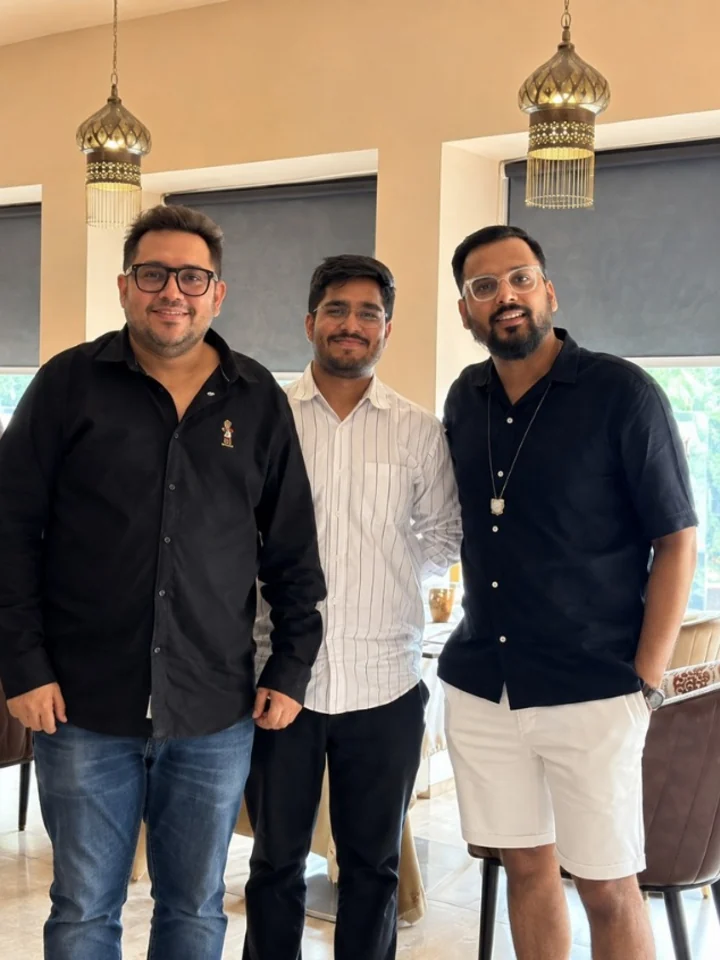 Nikhil photographed with his hosts in the dining room at Tajnuma, Agra