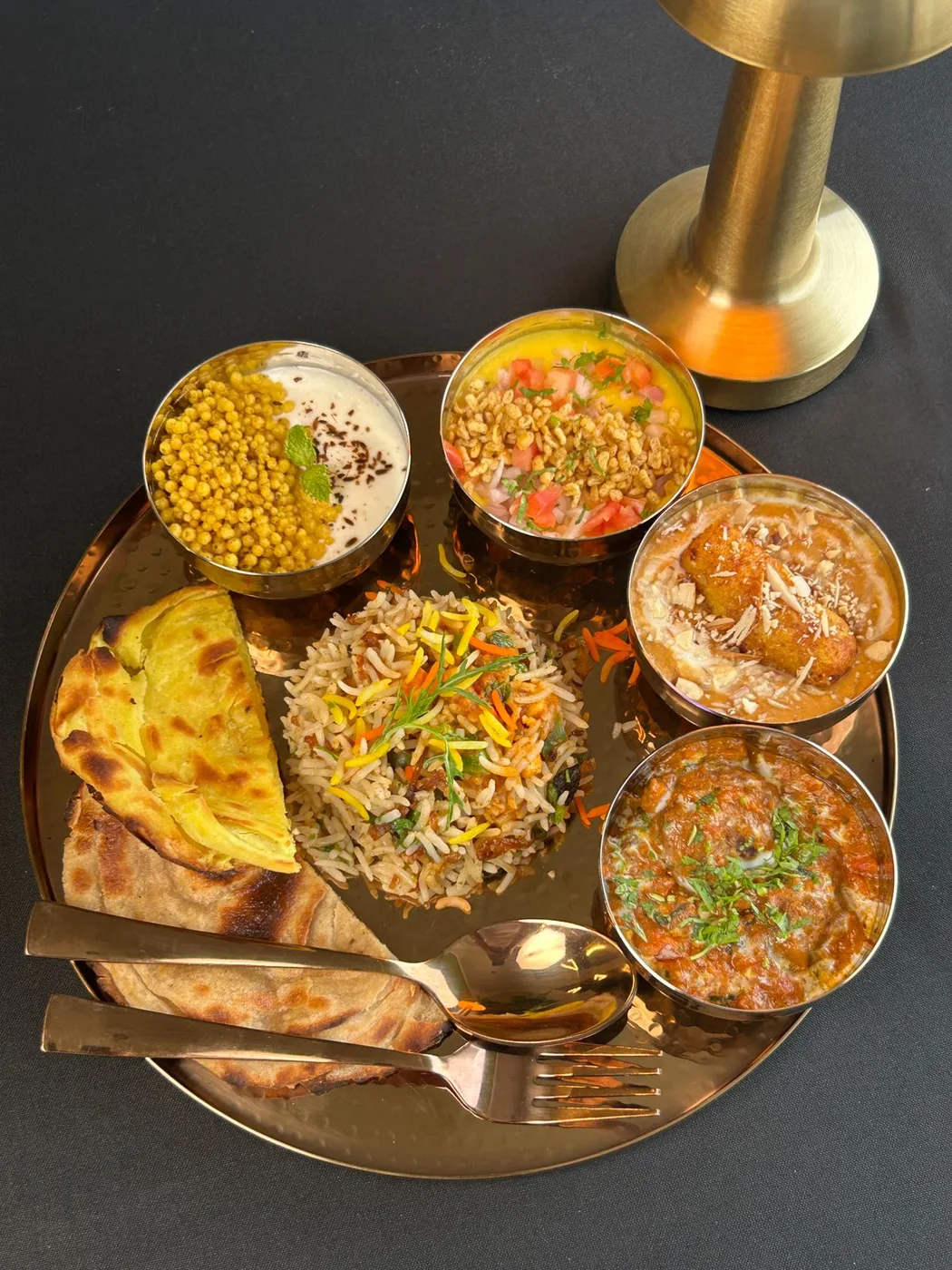 A platter of small sweet and chaat courses served at Tajnuma, Agra