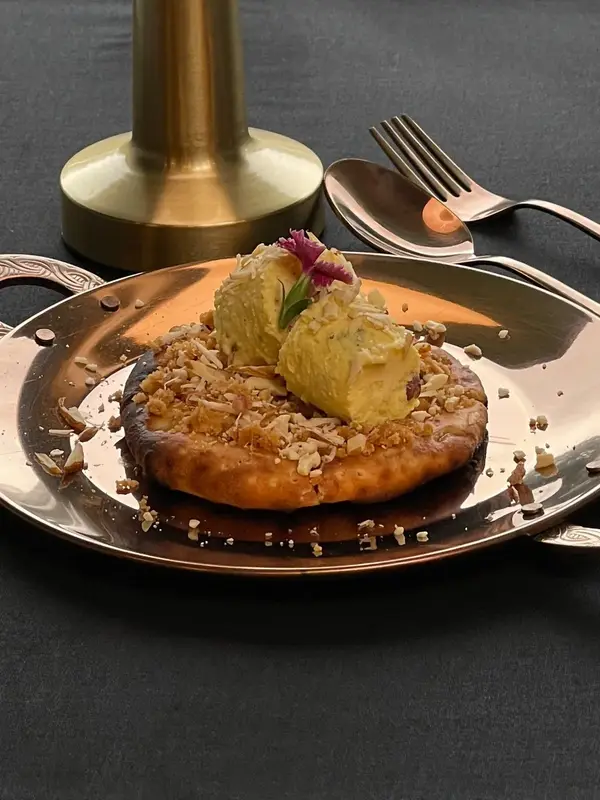 A tasting course on a copper plate. Tajnuma, Agra.