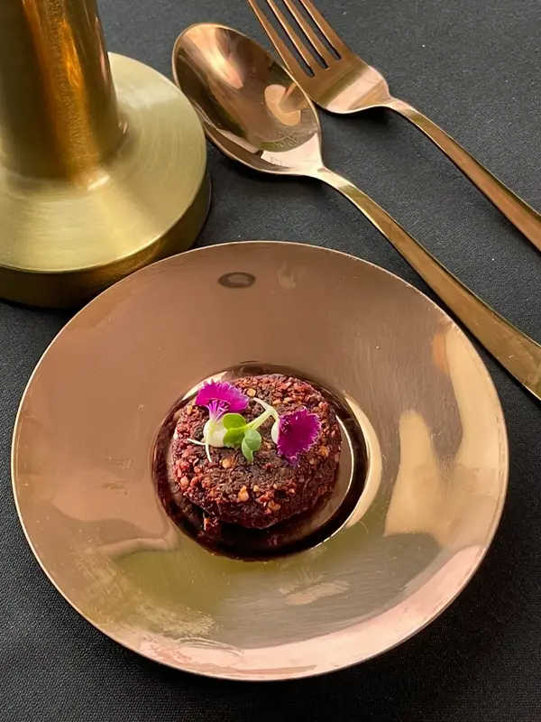 Served on a copper plate with brass cutlery. Tajnuma, Agra.