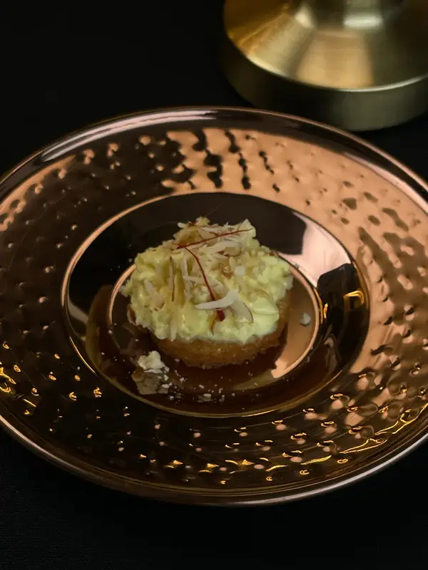 A tasting course on a copper plate. Tajnuma, Agra.