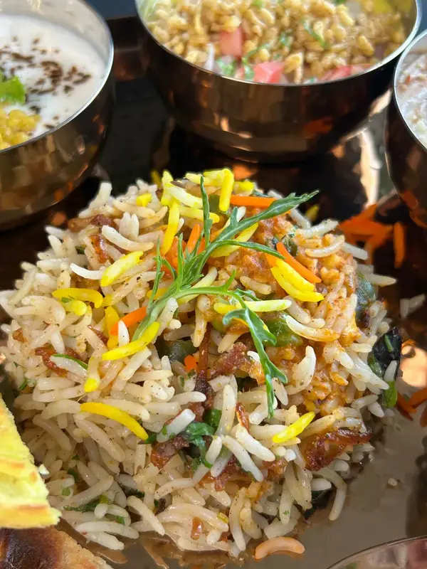 Fragrant rice, slow-cooked and garnished. Tajnuma, Agra.