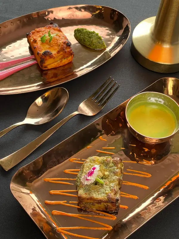 Street-food flavours, plated for fine dining. Tajnuma, Agra.